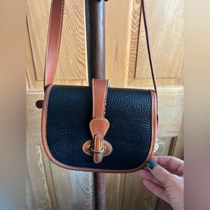 Dooney & Bourke leather crossbody equestrian purse, black and tan
